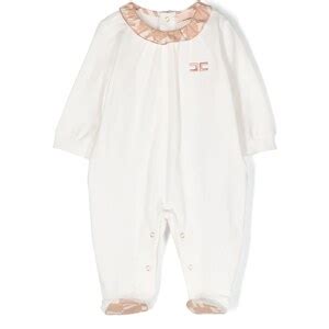 tutina bianca elegante per neonata con dettagli dorati
