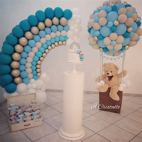 Allestimento tavola battesimo con palette di colori pastello e dettagli in argento