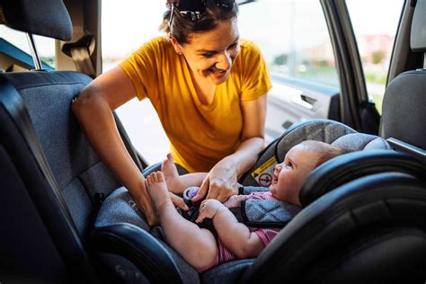 Child in car seat with parents