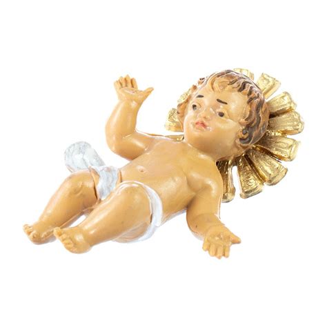 Tradizione del Kindelwiegen con una statuetta di Gesù Bambino