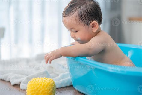 Image of a baby enjoying a bath