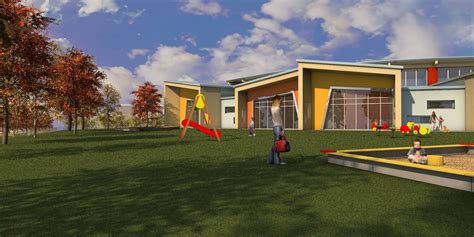 Una vista aerea di una scuola materna moderna che integra spazi verdi esterni e architettura ecosostenibile