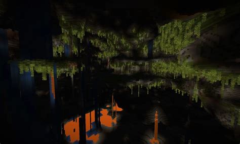 Depositi di guano visibili in una grotta lussureggiante di Minecraft, con stalattiti e vegetazione unica