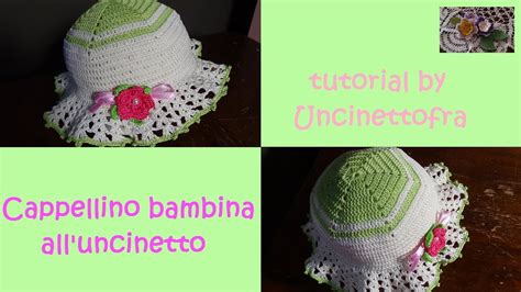 bambina con cappellino all'uncinetto decorato con pon pon