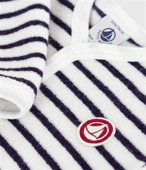 Dettaglio tessuto cotone Petit Bateau cerimonia neonato