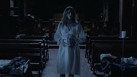 Pregnant woman in horror film style with a demonic shadow