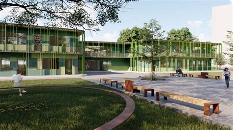 Veduta d'insieme di una scuola materna moderna immersa nel verde con spazi gioco all'aperto