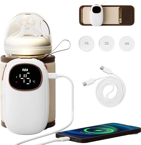 foto di un kit da viaggio completo: scaldabiberon a secco, contenitore per latte e sterilizzatore UV portatile