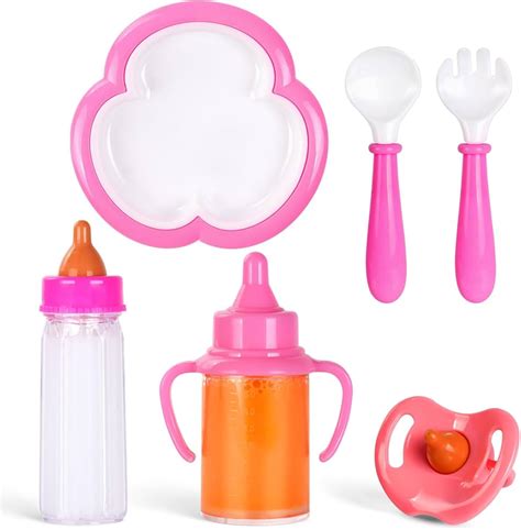 Set di biberon e accessori per neonati in ordine su un tavolo