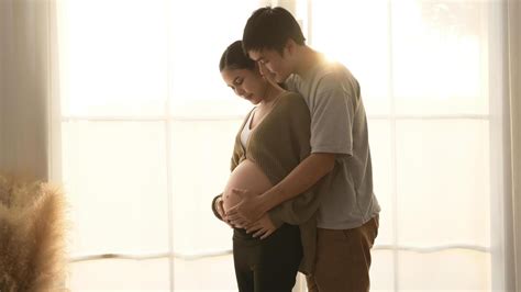 Couple embracing during pregnancy