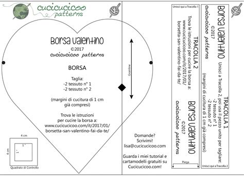 cartamodello in cartoncino a forma di cuore e strumenti da cucito