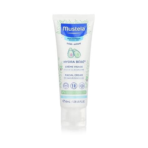 bambino felice con crema mustela