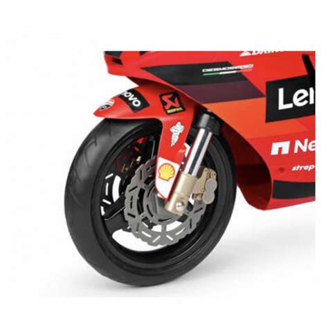 Dettaglio della carenatura sportiva della Ducati GP Peg Perego che mostra il logo e il design aerodinamico