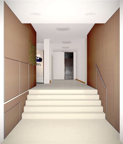 Androne condominiale con scala e porta d'ingresso