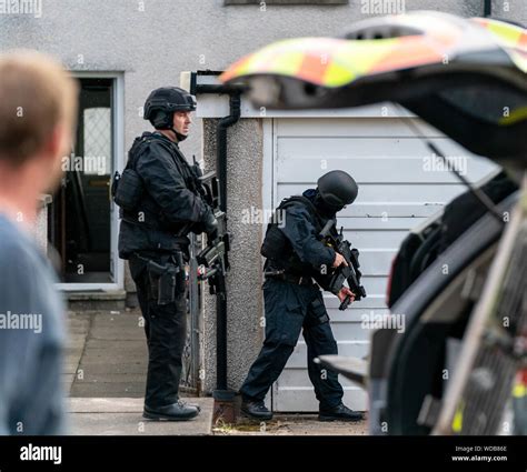 Police officers conducting a raid