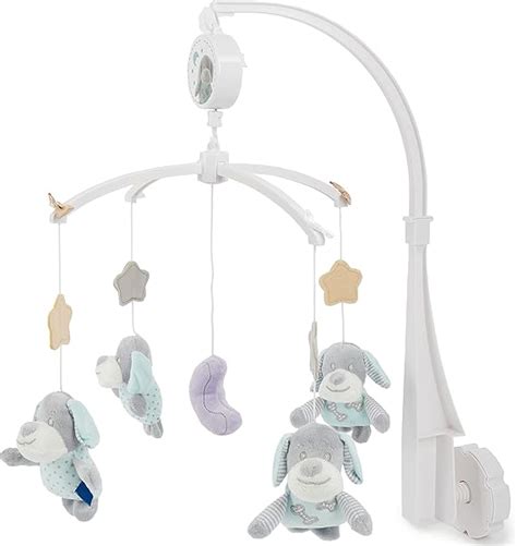 Giostrina per neonati in stile minimalista e colori pastello appesa sopra una culla in legno