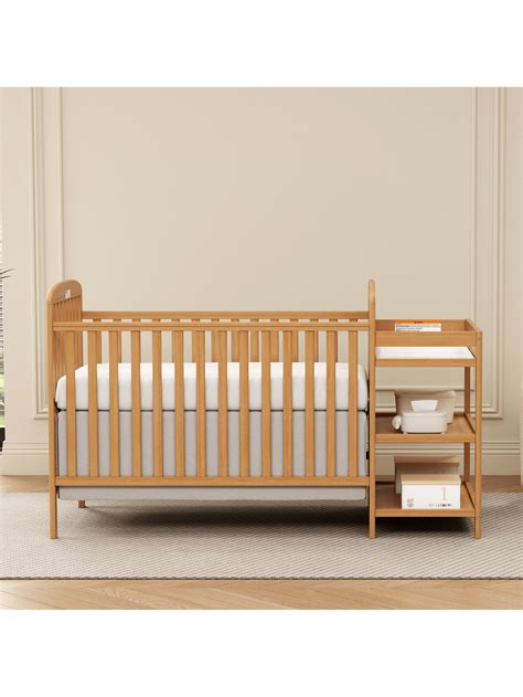Convertible crib transforming into a desk