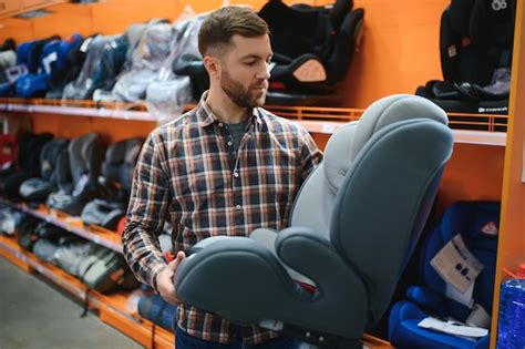 Parents choosing a car seat in a store
