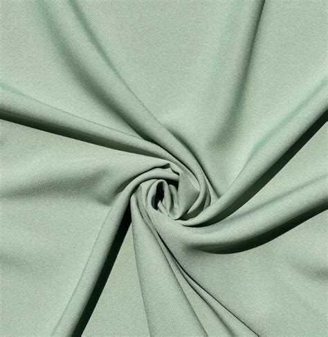 Diagramma che illustra la composizione a strati: cotone, imbottitura in poliestere e tessuto esterno