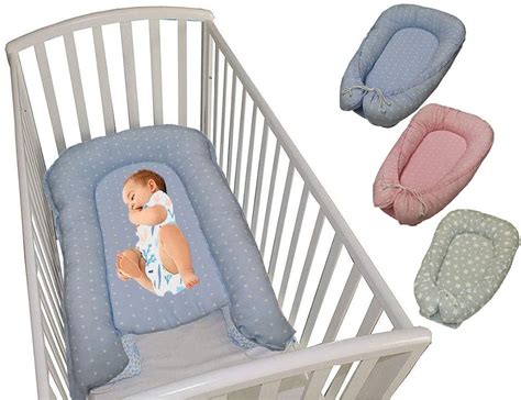 diagramma posturale neonato nella culla con riduttore