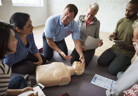 Community members learning first aid