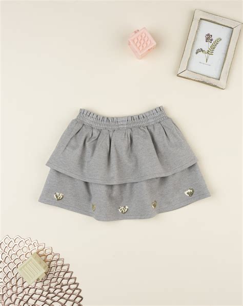 Bimba con leggings fantasia e gonna Prénatal