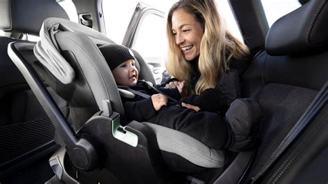 Child car seat being placed on a car seat