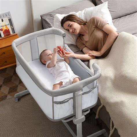 Newborn sleeping in a bassinet with just a mattress