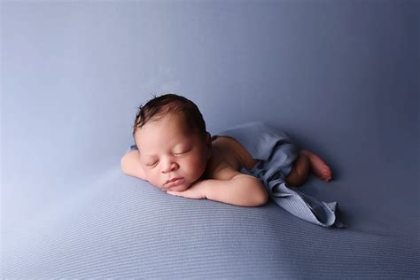 Newborn baby safely posed on a beanbag