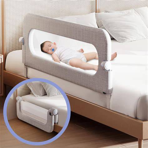 Child sleeping safely in bed with a bed rail