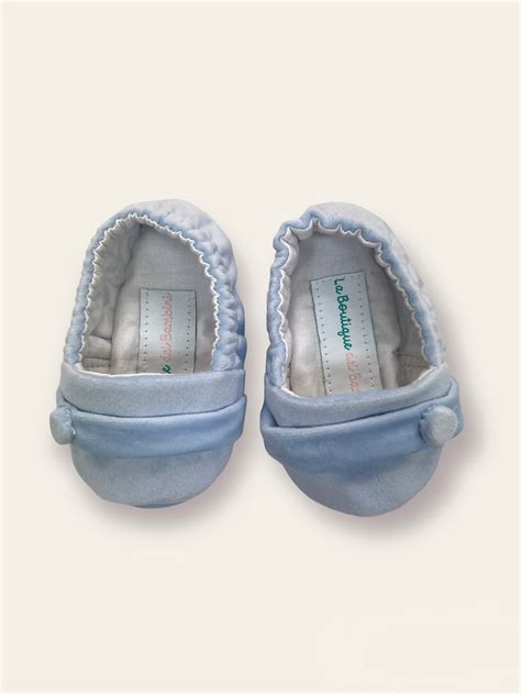 Scarpine da culla finite con decorazioni