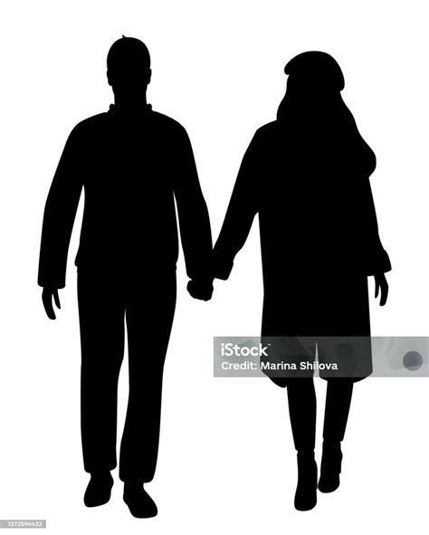 Donna incinta e uomo che si tengono per mano