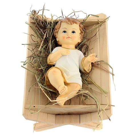 Gesù Bambino nella culla e presepe
