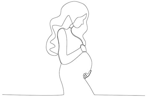 Donna incinta che guarda il suo ventre