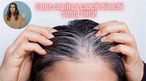 Donna incinta che si tocca i capelli bianchi