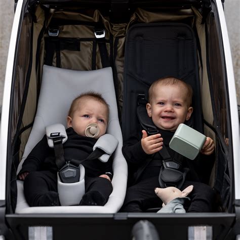 Thule Infant Sling inside a Chariot trailer
