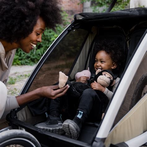 Child enjoying comfort inside Thule Chariot