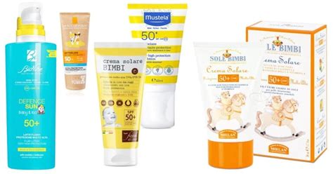 neonati in spiaggia con crema solare