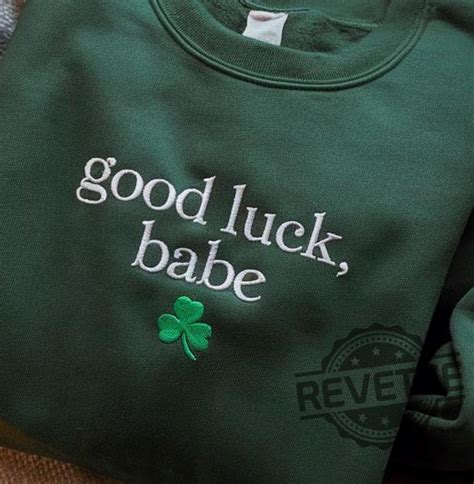 Intricately embroidered baby good luck shirt