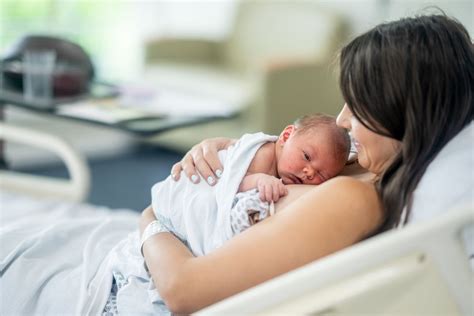 Mother holding her premature baby in skin-to-skin contact (Kangaroo Care)