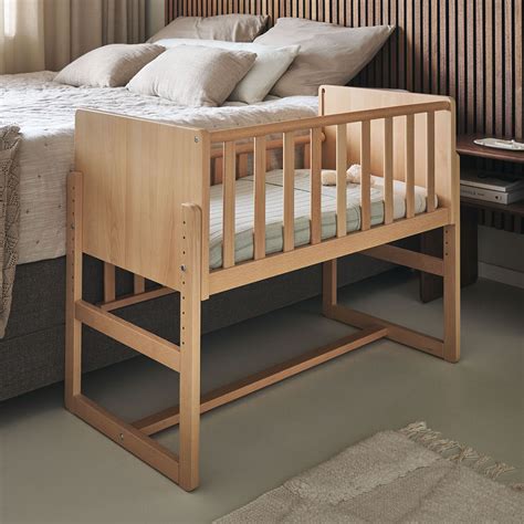 Illustration of a co-sleeping crib attached to a parent's bed