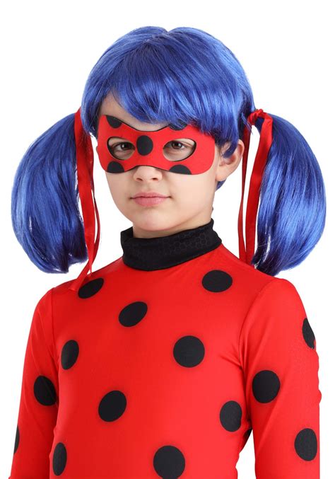 Girl wearing official Ladybug costume and wig posing confidently
