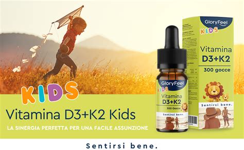 Bambino che riceve gocce di vitamina D da un genitore
