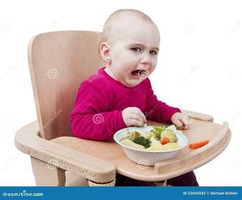 Child eating in a high chair