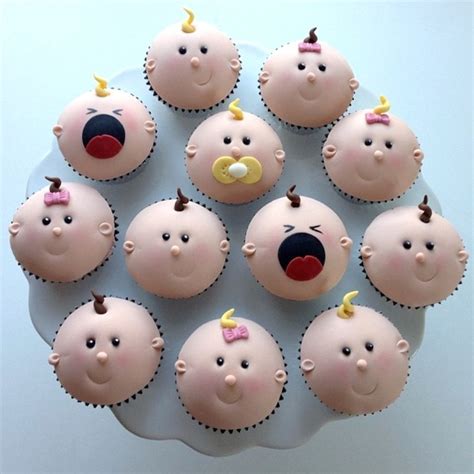 Cupcakes with baby decorations in an office setting