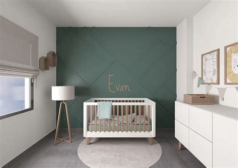 Culla per neonati in legno color verde scuro posizionata in una cameretta moderna