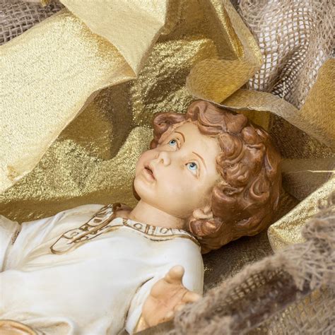 Dettaglio del volto di un Bambino Gesù in culla