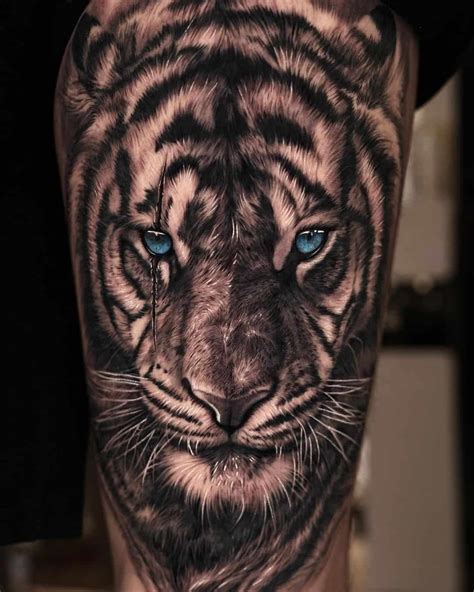 Tattoo of a tiger with the phrase