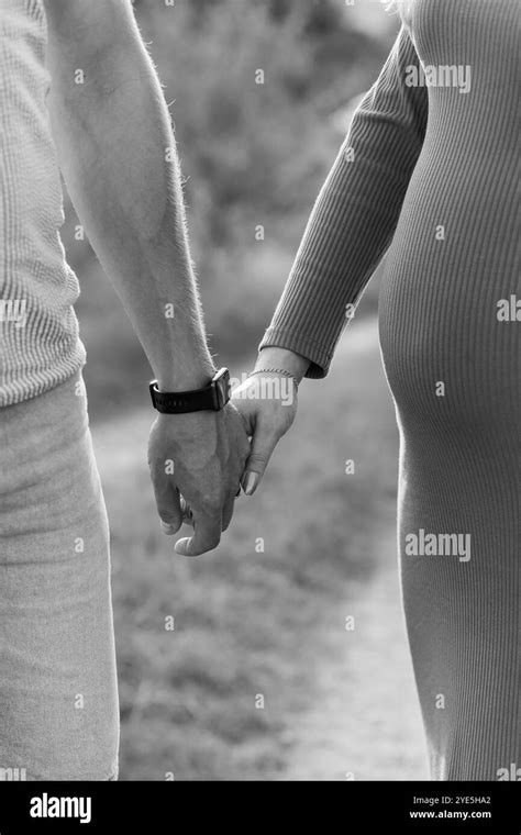 Couple in intimate moment during pregnancy