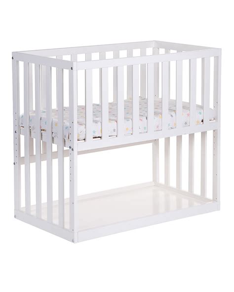 Culla co-sleeper accanto al letto dei genitori